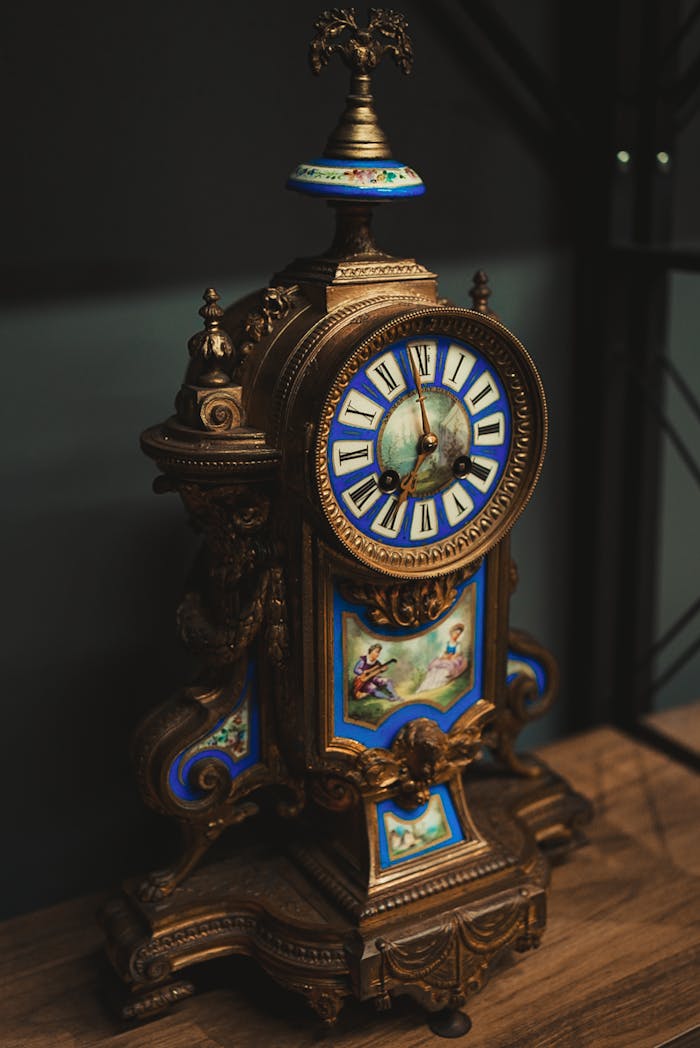 Elegant antique French clock with ornate design in a luxurious setting.