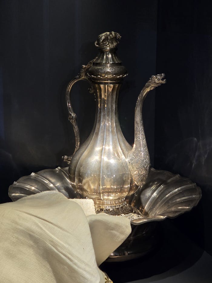 A decorative Ottoman-style silver water pitcher with detailed engravings and elegant design.